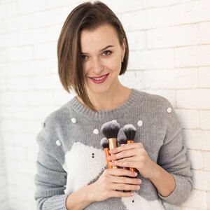 Girl with makeup brush kit